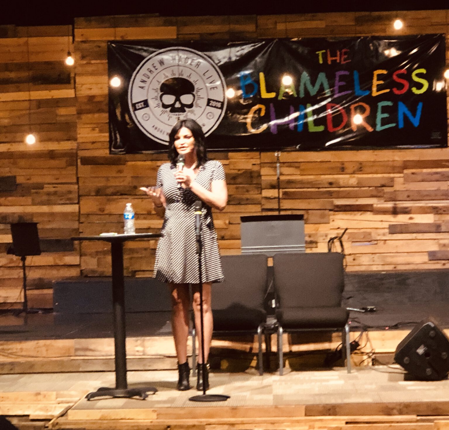 Jennifer Gimenez-Ryan speaking on stage
